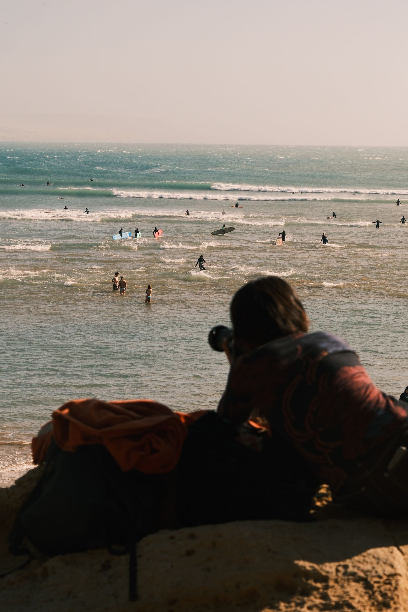 Surf photographer shooting waves on the beach in Weligama, Sri Lanka